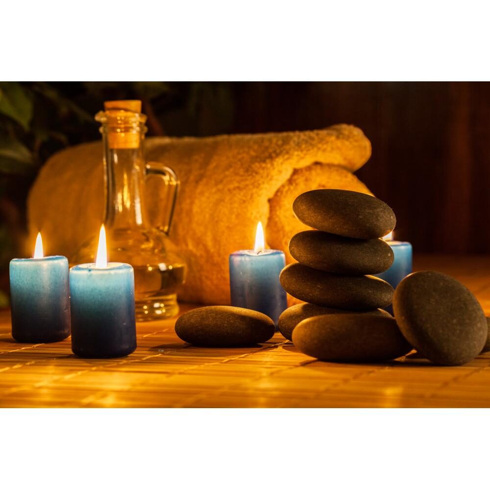Spa still life with hot stones and candles